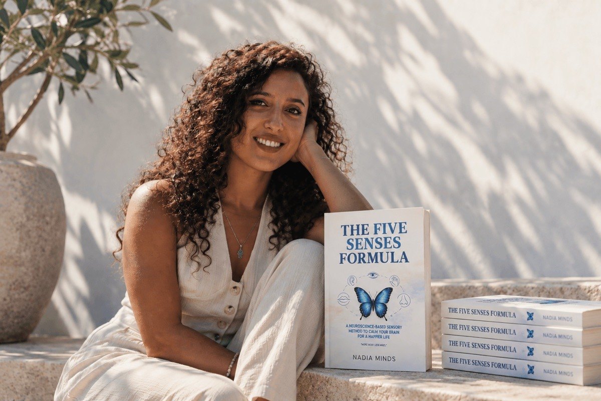 Nadia Minds with her book, The Five Senses Formula